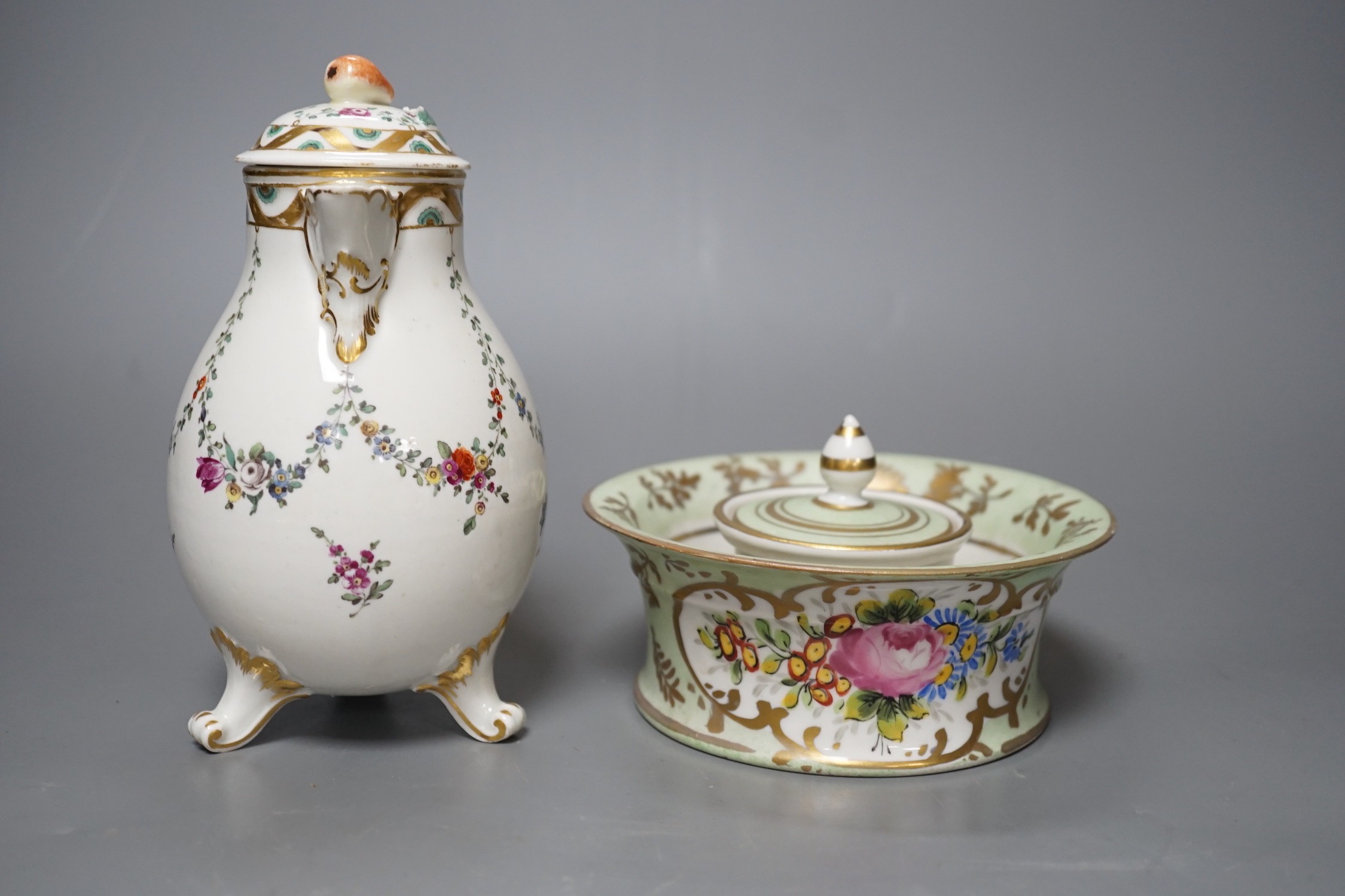 A Ludwigsburg three footed jug and cover painted with swags of flower c. 1770 and a 19th century French porcelain inkwell and cover a colourful gilt floral panel, jug and cover 17 cms high